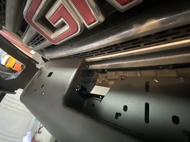 Close-up showing tight fit of Warn VR8000 winch in ARB bumper